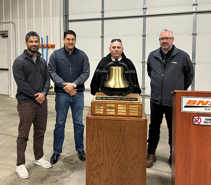Don Eslinger, second from right, celebrates the shop’s recent Safety Bell achievement with Keith Solomons, vice president, Mechanical; Edmundo Rodriguez, assistant vice president and chief mechanical officer; and Justin Miller, general foreman, Mechanical.