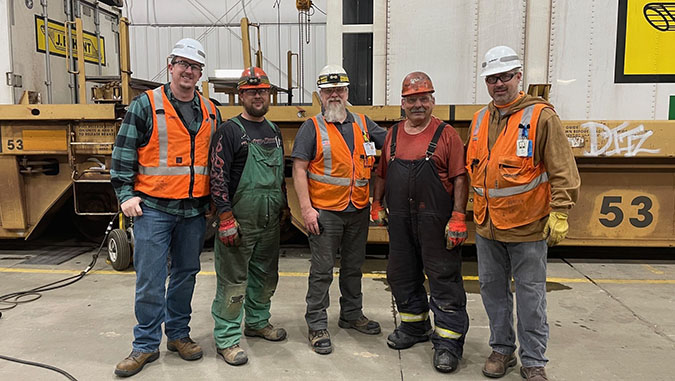 Don Eslinger with "the boys" at work. Left to right, Trainmaster Thadeus Fitchett, Carman Mike Simonson, Mechanical Foreman II Chad Vogele, Eslinger and General Foreman Justin Miller