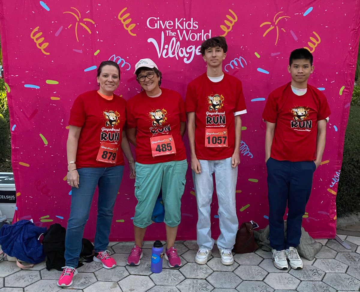 Felicia Morgan, her aunt and two foreign exchange students before the Give the Kids the World 5K fundraiser run