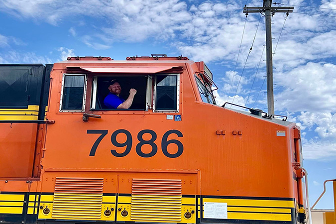 Mayor Clint McBroom aboard a stationary train display at Newton’s 150th celebration.