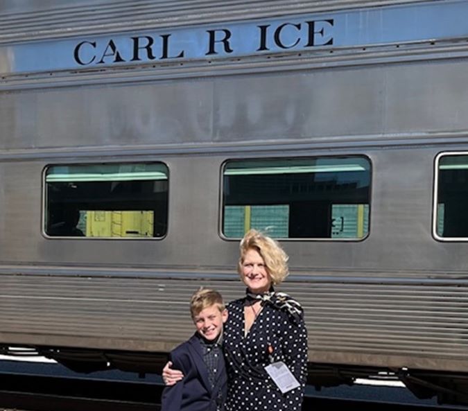 Ombudsman Mignon Lambley with her son on a rail industry train trip 